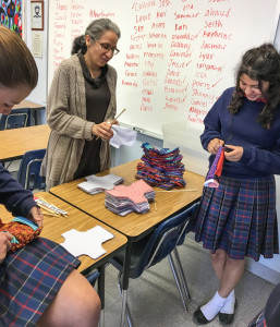 Dr. Salcido helps club members with a project to aid women in third world countries.