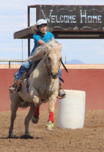 Allie Evdokimo specializes in Western style riding, which includes barrel racing.