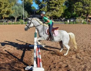 Brenna Foreman specializes in English style riding, which includes jumping.