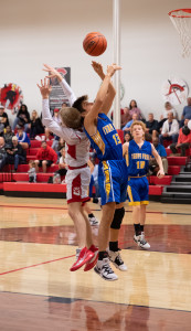 Gabriel Huerta McWhirter snags the rebound during game at Leading Edge Academy.