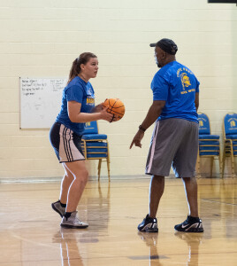 Coach McClary works with Natalie Whitmer during a recent practice.