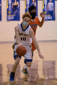 Nolan Bailey shoots over his opponent