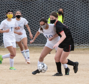 Cienna Jaime dribbles around her opponent.