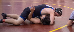 Michael DeGeeer pins his opponent