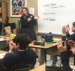 Clara Moffitt leads a discussion during a Herstory Club meeting.